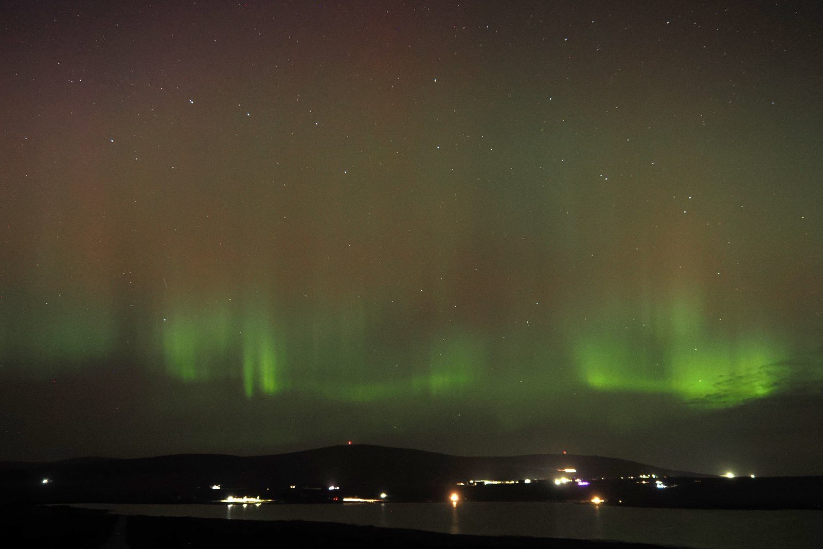 Green northern lights over Haroldswick in Shetland
