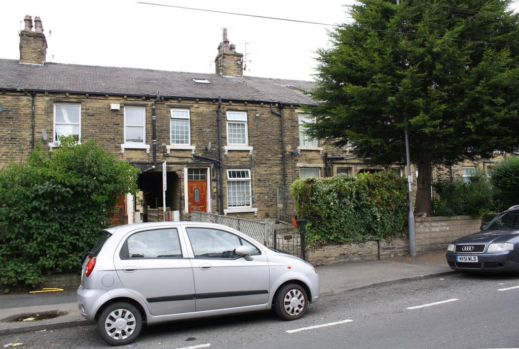 Terraced houses on Heaton Road with a car parked on the street outside