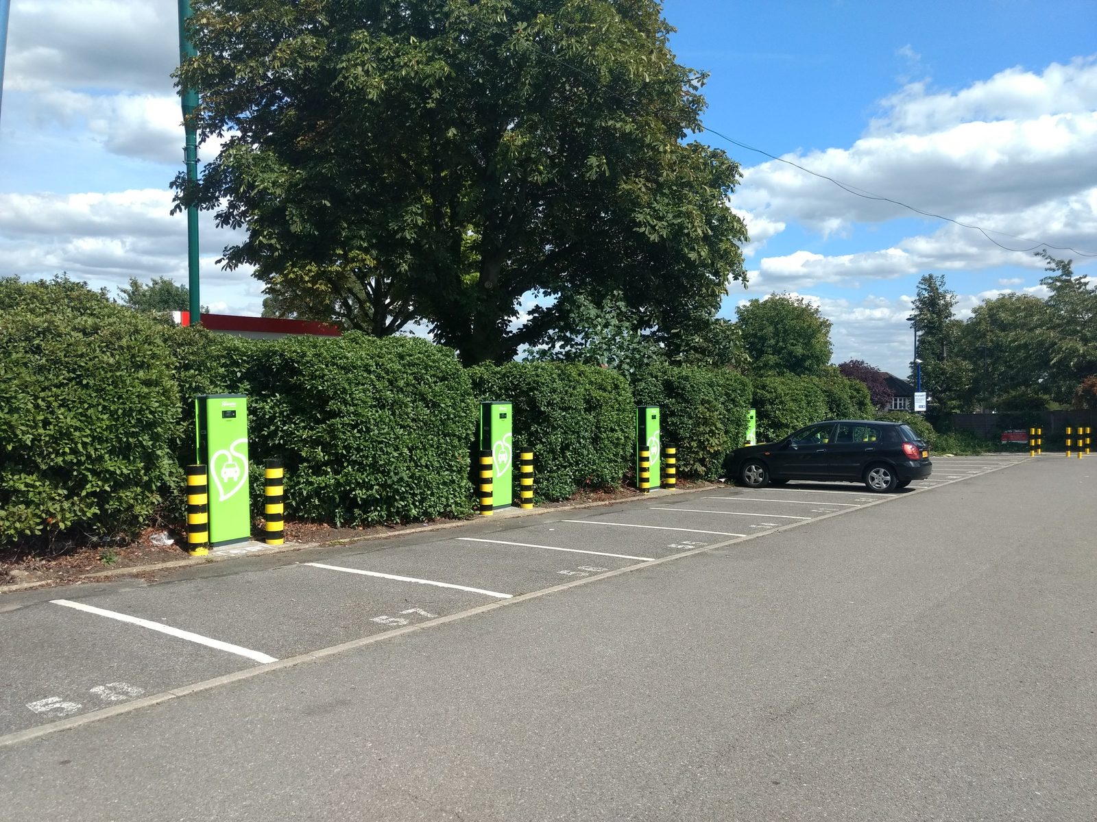 Public electric vehicle charging points in a car park at Oakwood in London