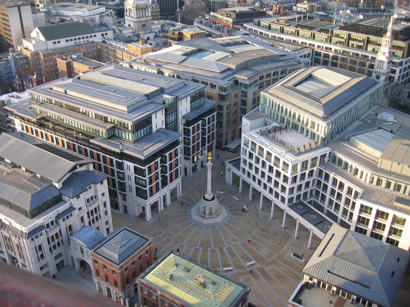 Paternoster Square in the City of London seen from above, with its central column and the London Stock Exchange building on the right