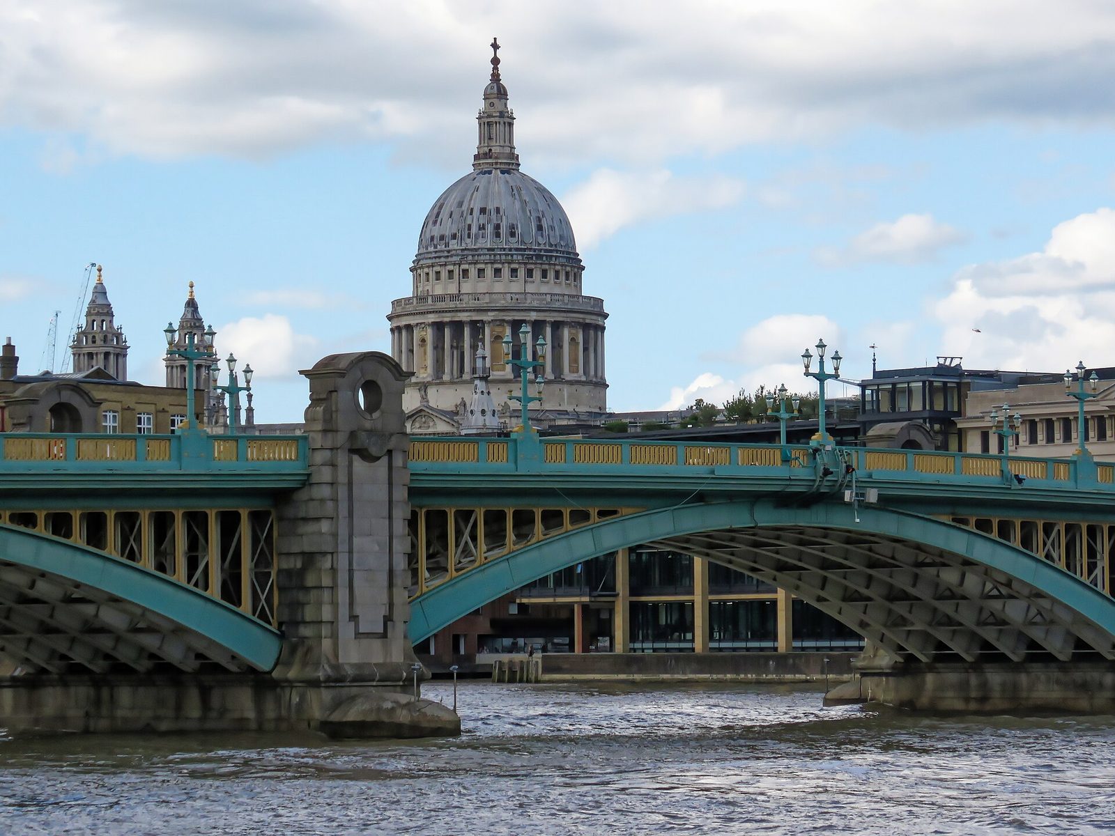 Southwark Bridge over the River Thames in London, with St Paul's Cathedral behind