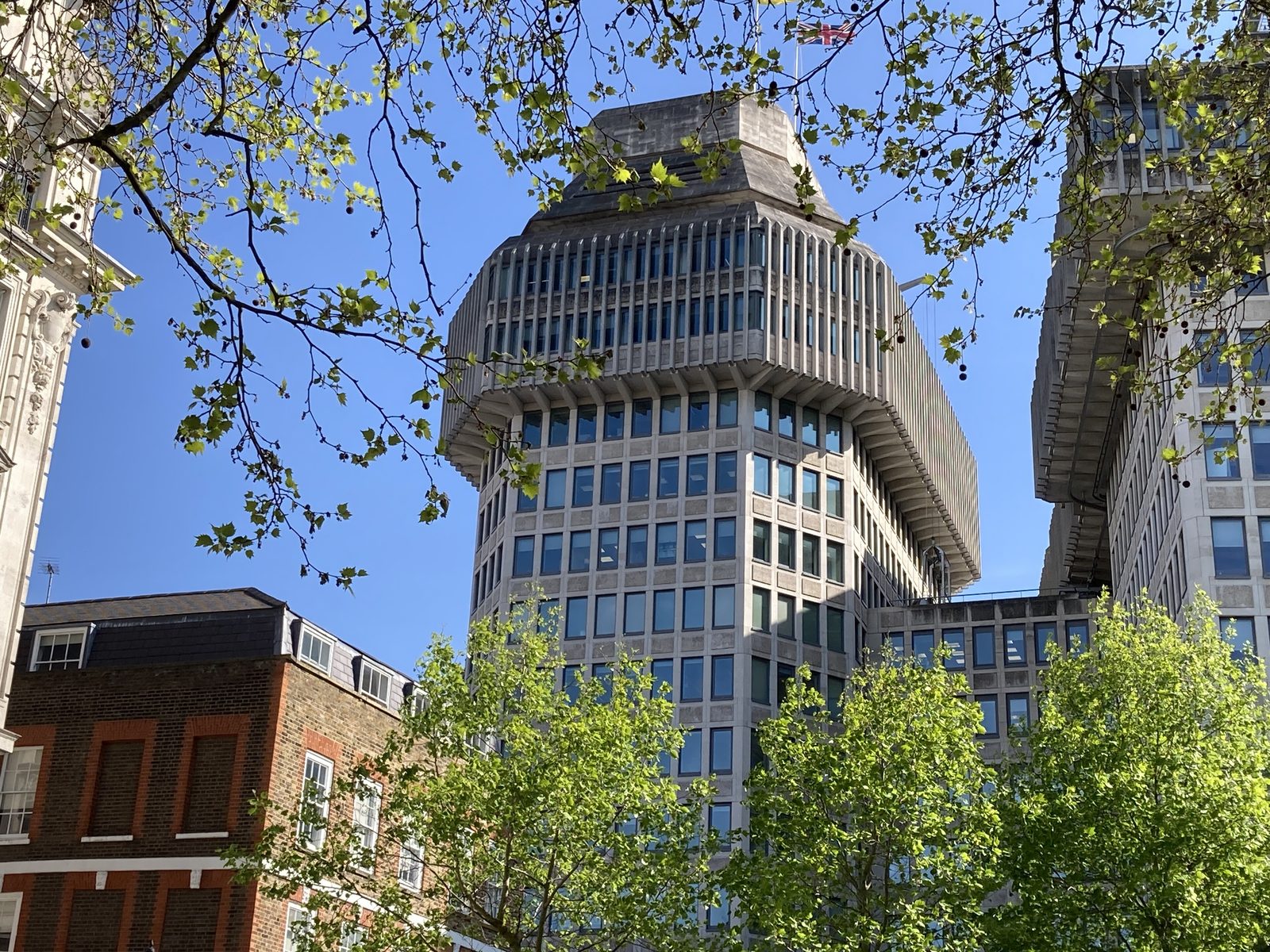The Ministry of Justice building at Petty France in London, seen through trees