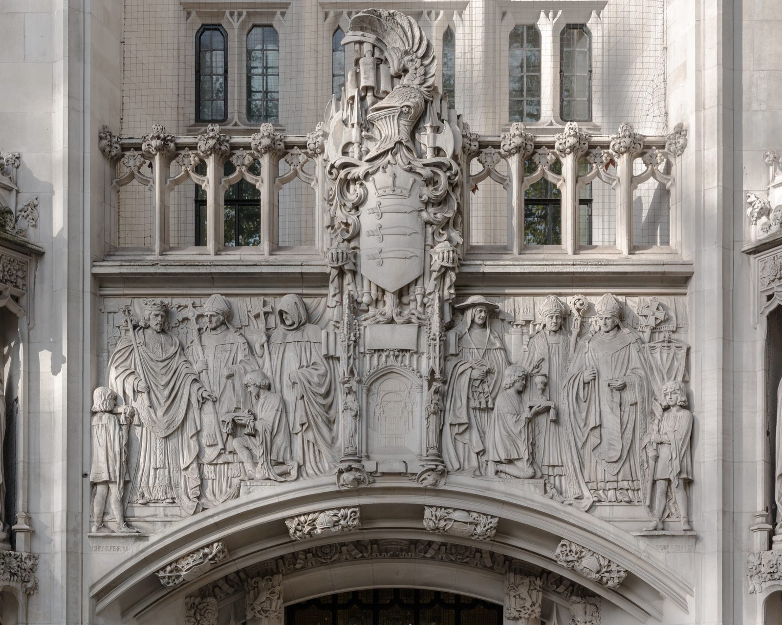 The carved stone frieze above the entrance of the Middlesex Guildhall in Parliament Square, home of the Supreme Court