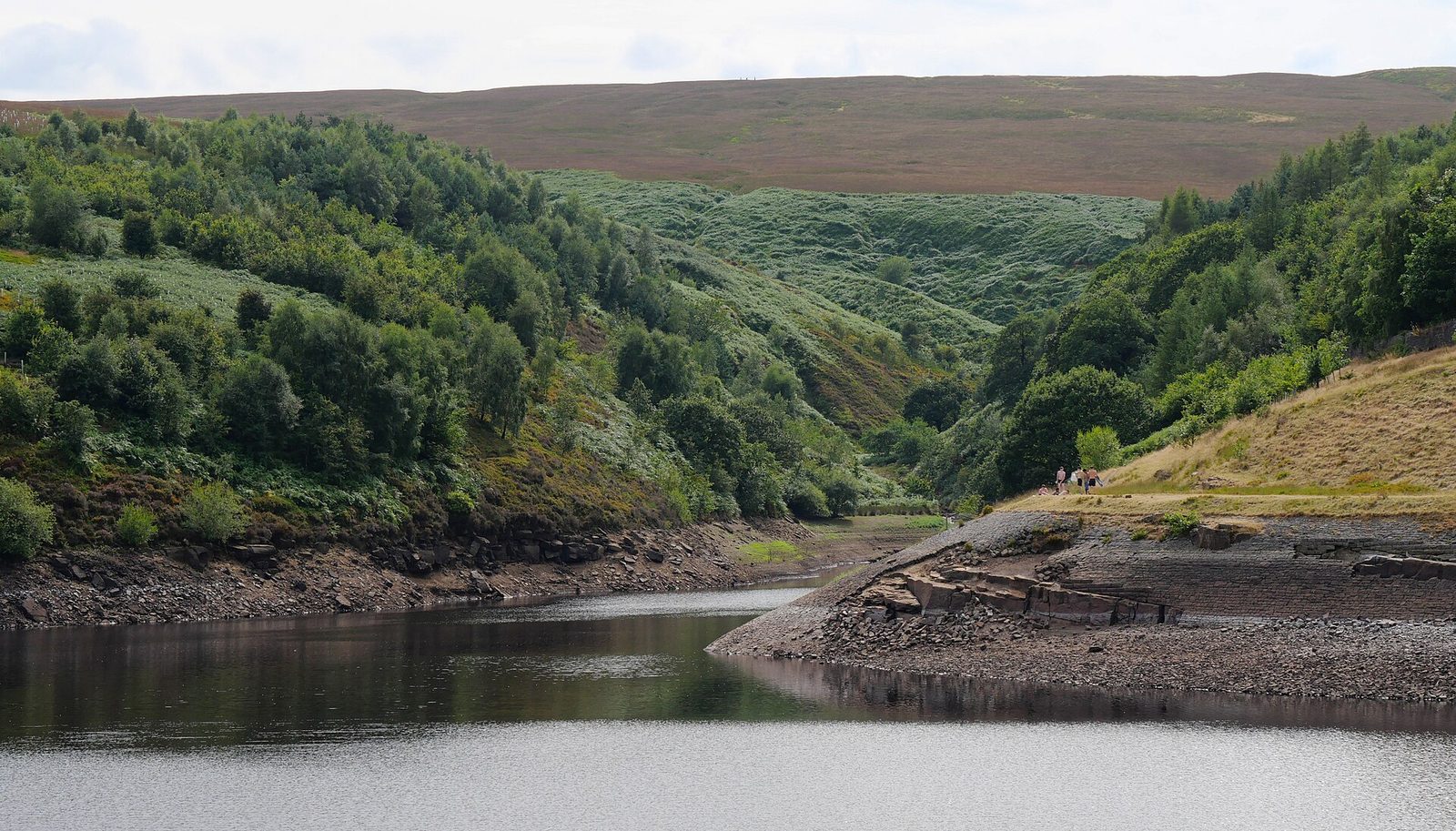 Butterley Reservoir at Marsden in West Yorkshire, set in a green valley below moorland