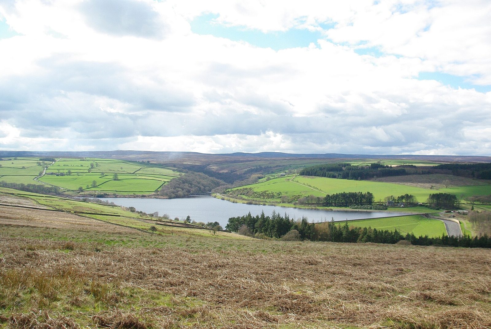 Leighton Reservoir in North Yorkshire, seen across fields and moorland
