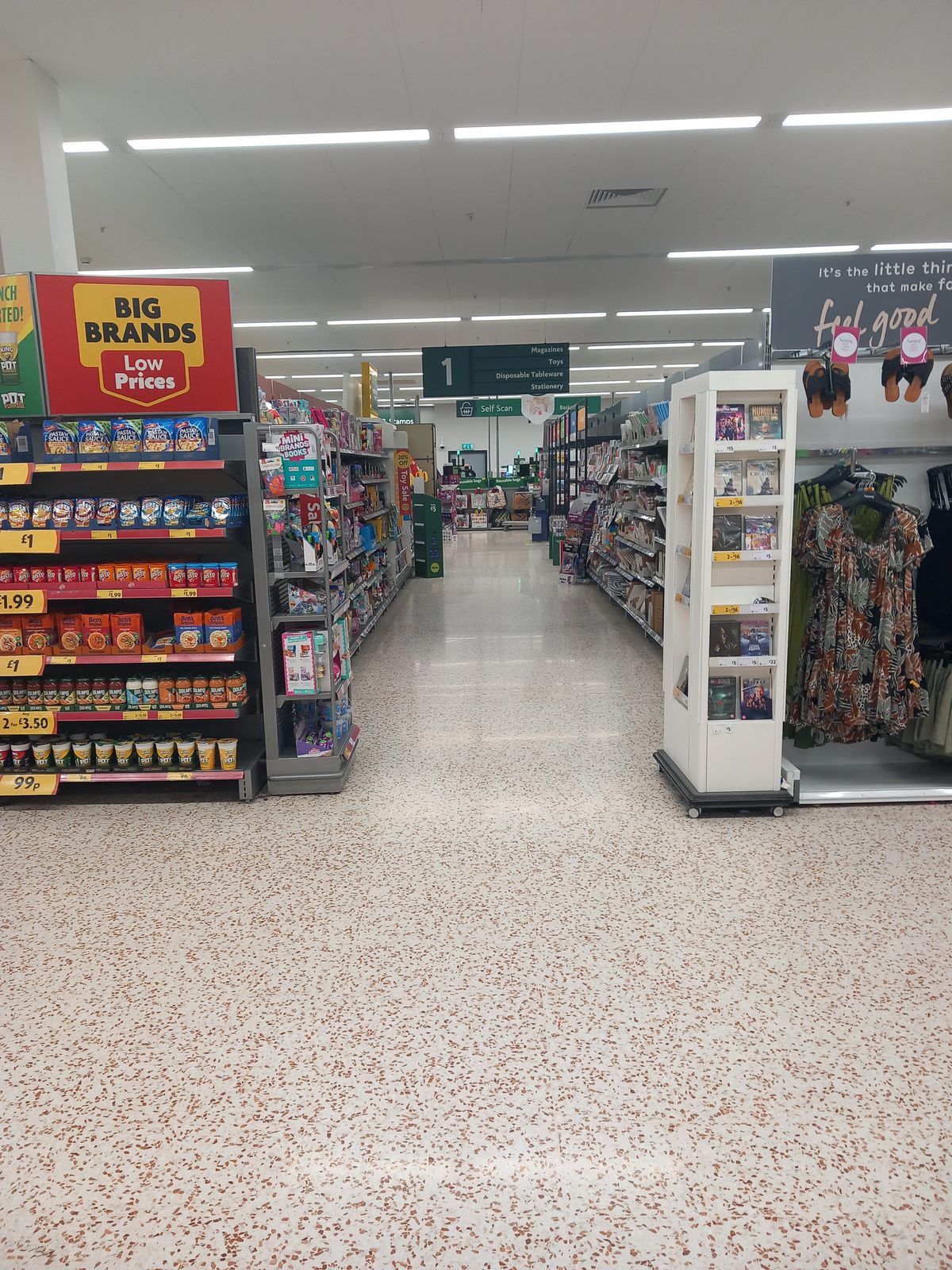 A supermarket aisle stocked with groceries