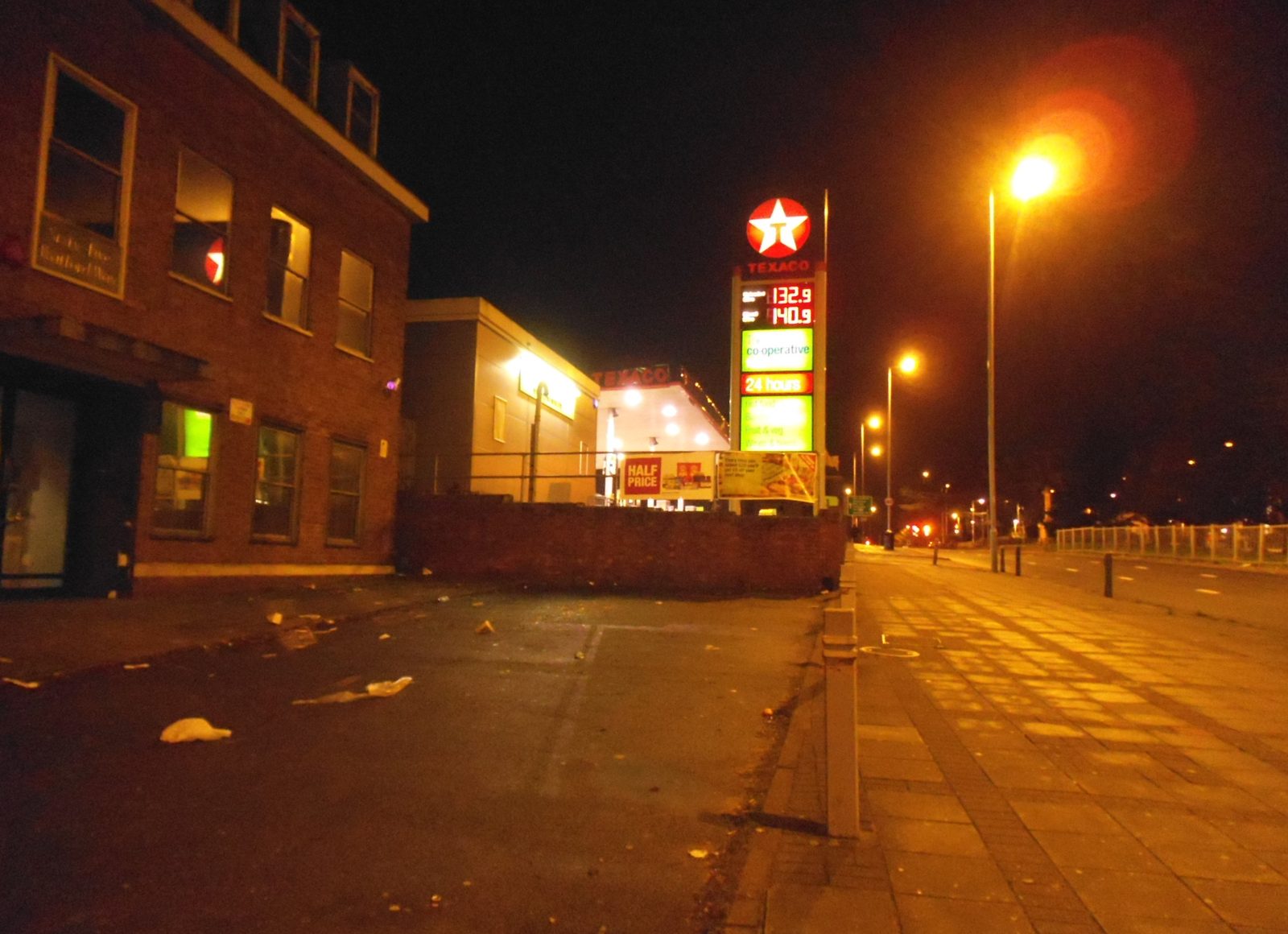 A Texaco price sign at night