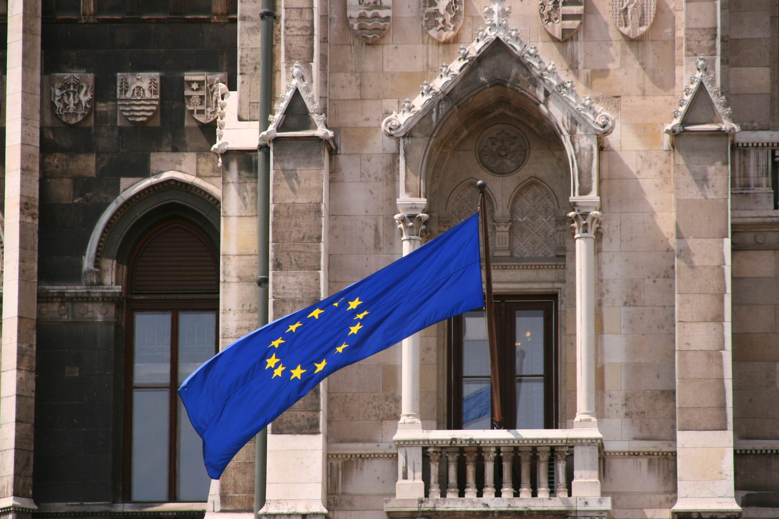 A European Union flag flying from the Hungarian parliament building in Budapest