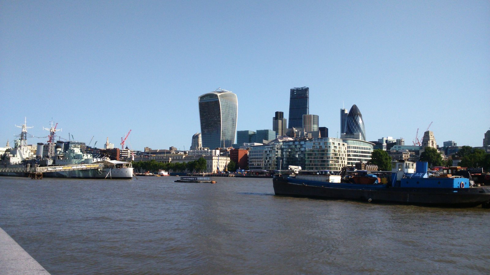 The City of London skyline seen from Tower Bridge, with HMS Belfast in the foreground
